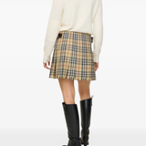 Tan skirts worn by a person, showing the skirts fit