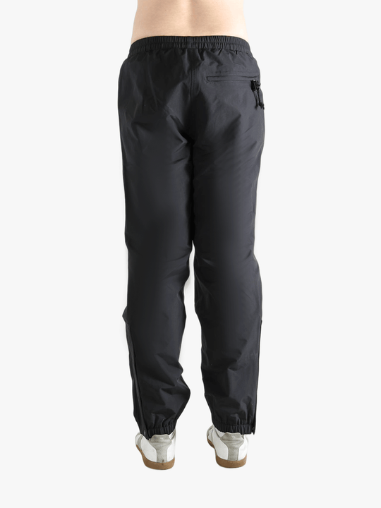 Black pants worn by a person showing the pants fit