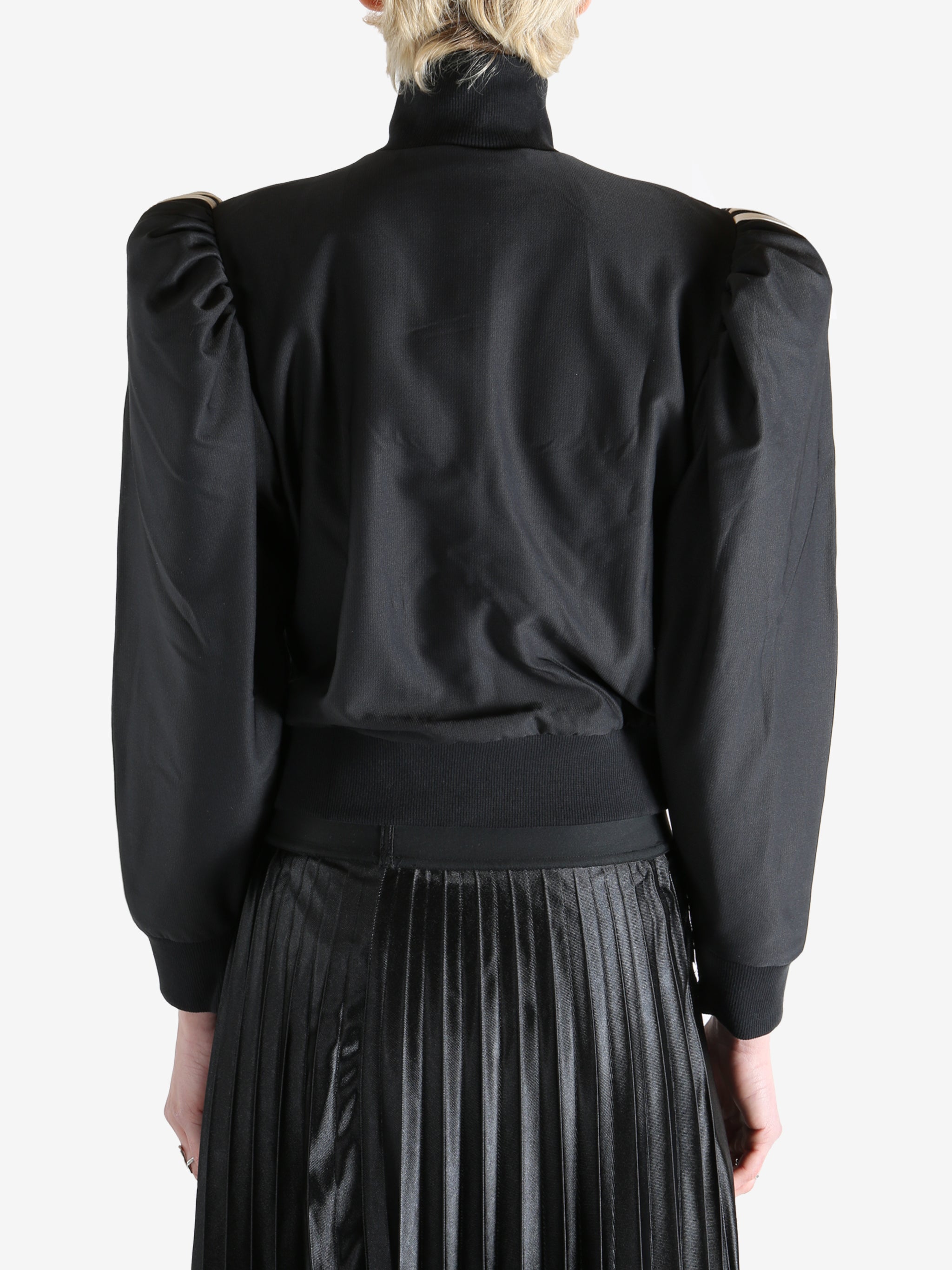 Black blouse worn by a person, showing the blouse's fit
