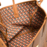 Close up of brown bag, showing texture of the leather fabric