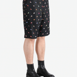 Black short worn by a person, showing the  shorts fit