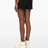 Black shorts worn by a person, showing the shorts fit