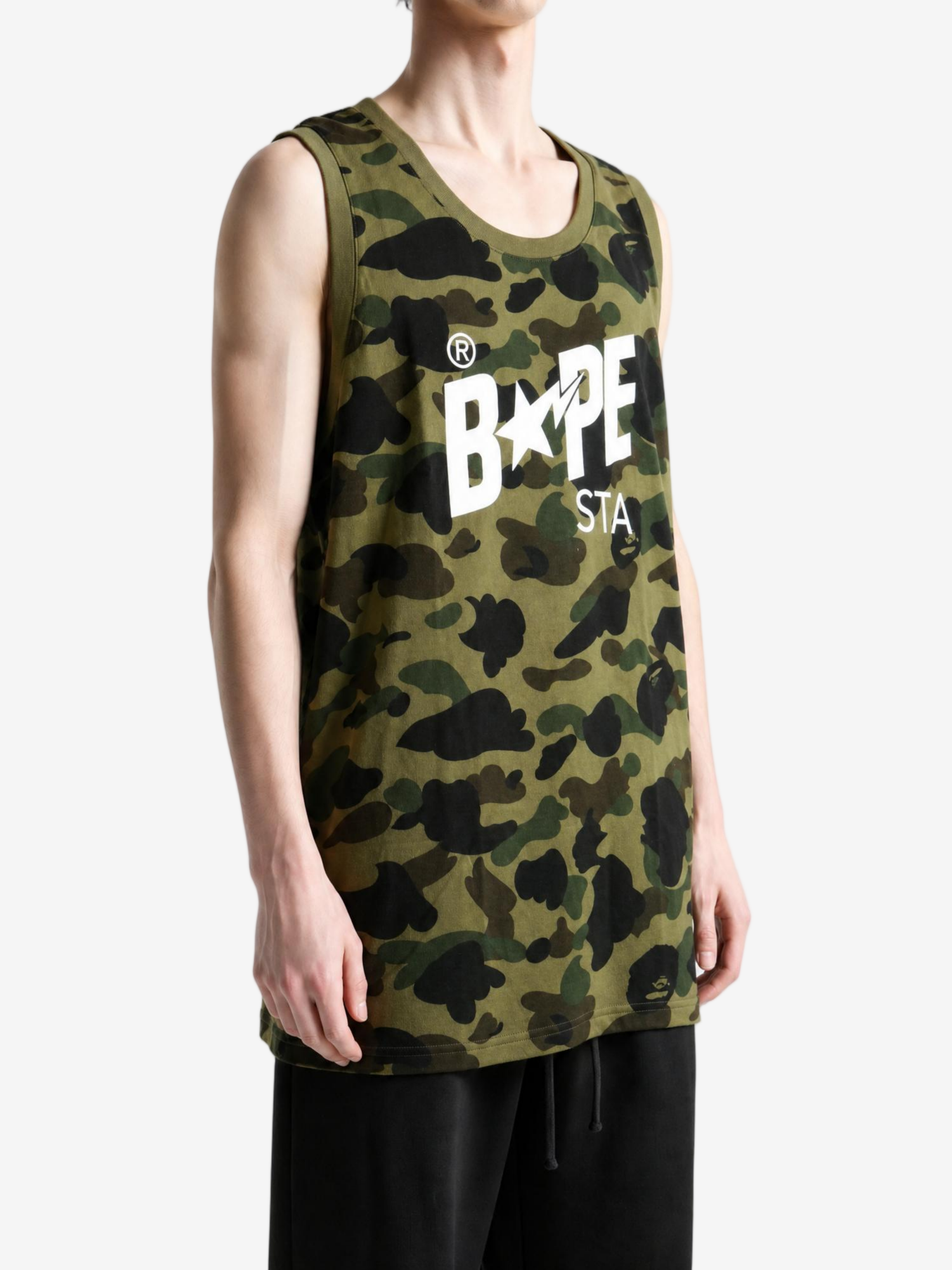 Green top worn by a person, showing the top fit