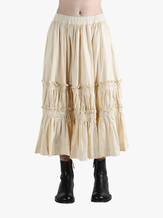 Beige tiered skirt worn by a person, showing the skirt fit
