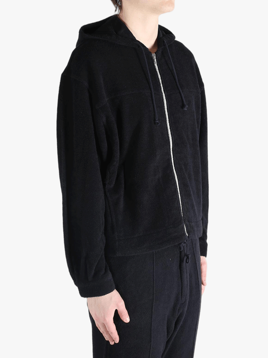 Black jackets worn by a person, showing the jackets fit