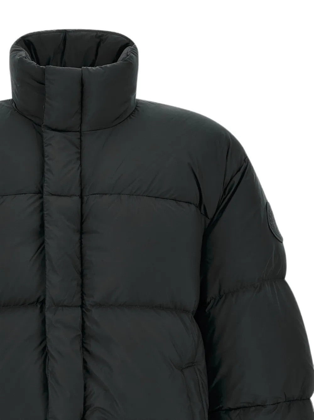 Close up of Black jacket, showing texture of the 100% polyester fabric