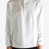 White sweatshirt worn by a person, showing the sweatshirt's fit