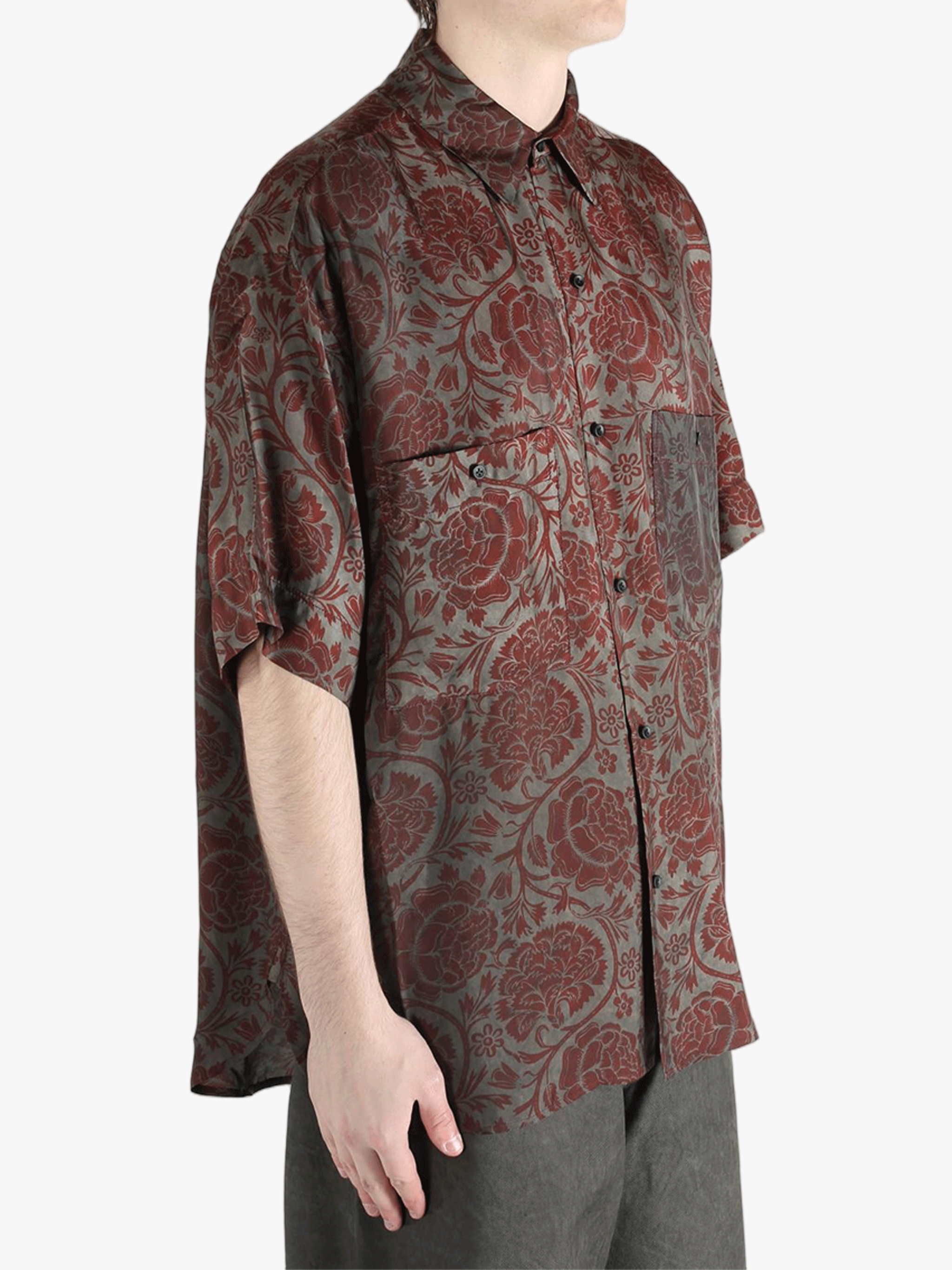 Grey shirt worn by a person, showing the shirt's fit