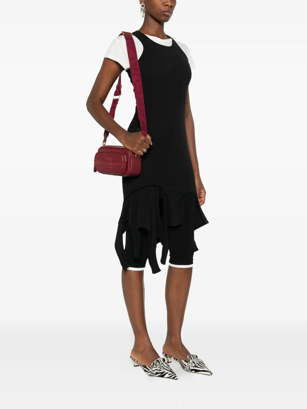 Red bag worn by a person, showing the bag's fit