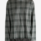 Grey shirt worn by a person, showing the shirt's fit