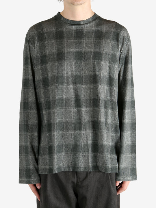 Grey shirt worn by a person, showing the shirt's fit