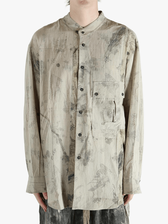 Grey shirt worn by a person, showing the shirt's fit