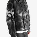 Black jacket worn by a person, showing the jacket's fit