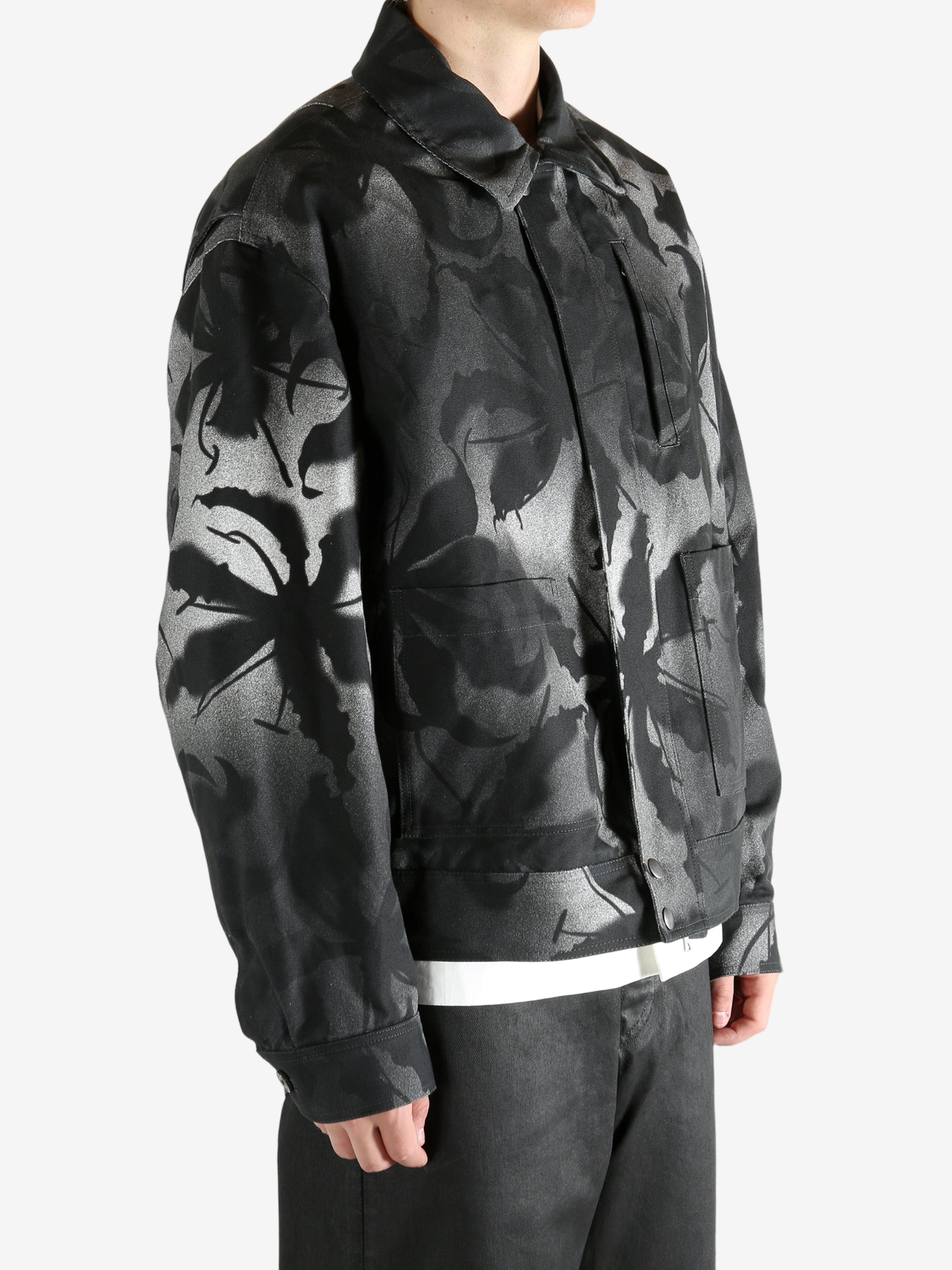 Black jacket worn by a person, showing the jacket's fit