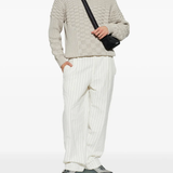 Grey sneakers, full body view