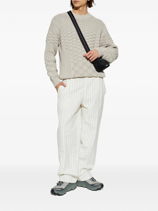 Grey sneakers, full body view