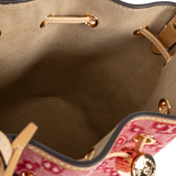 Close up of red bag, showing texture of the leather fabric