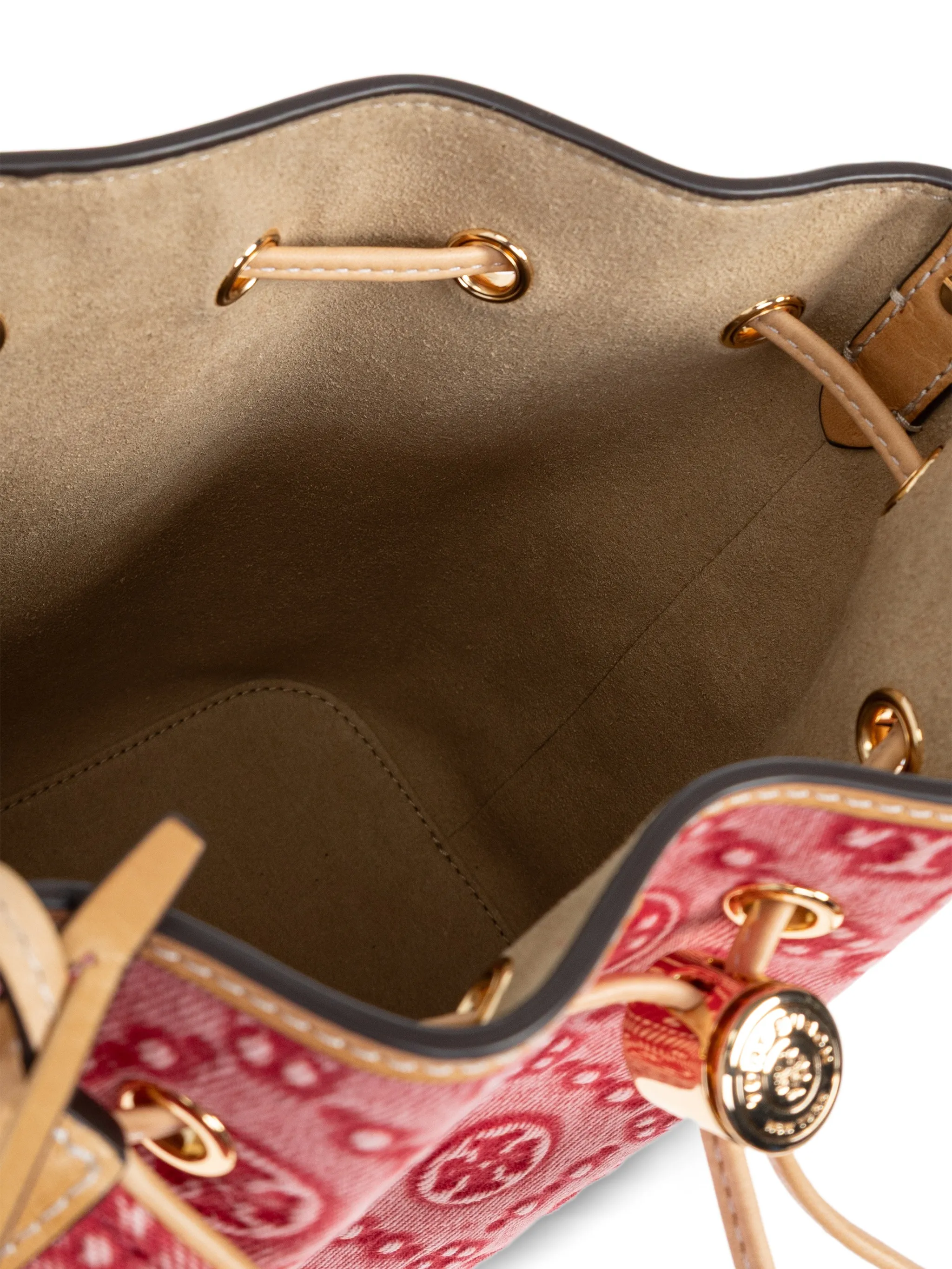 Close up of red bag, showing texture of the leather fabric