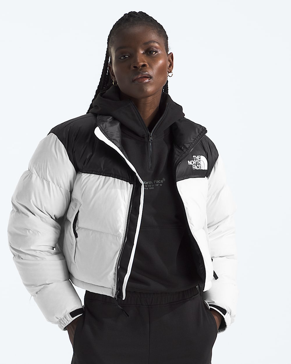 White jacket worn by a person, showing the jacket fit