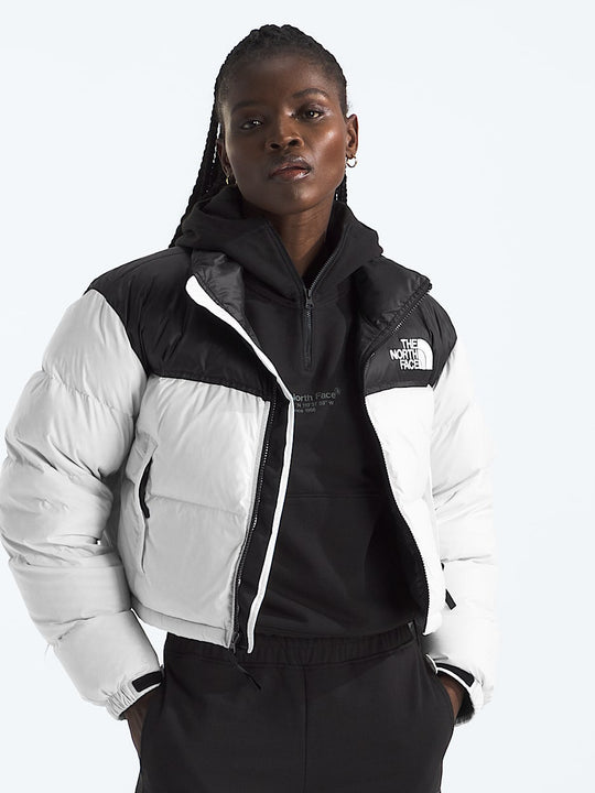 White jacket worn by a person, showing the jacket fit