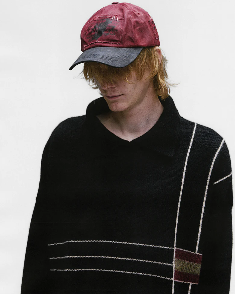 Red hat worn by a person, showing the hat's fit