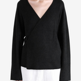 Black jacket worn by a person, showing the jacket fit