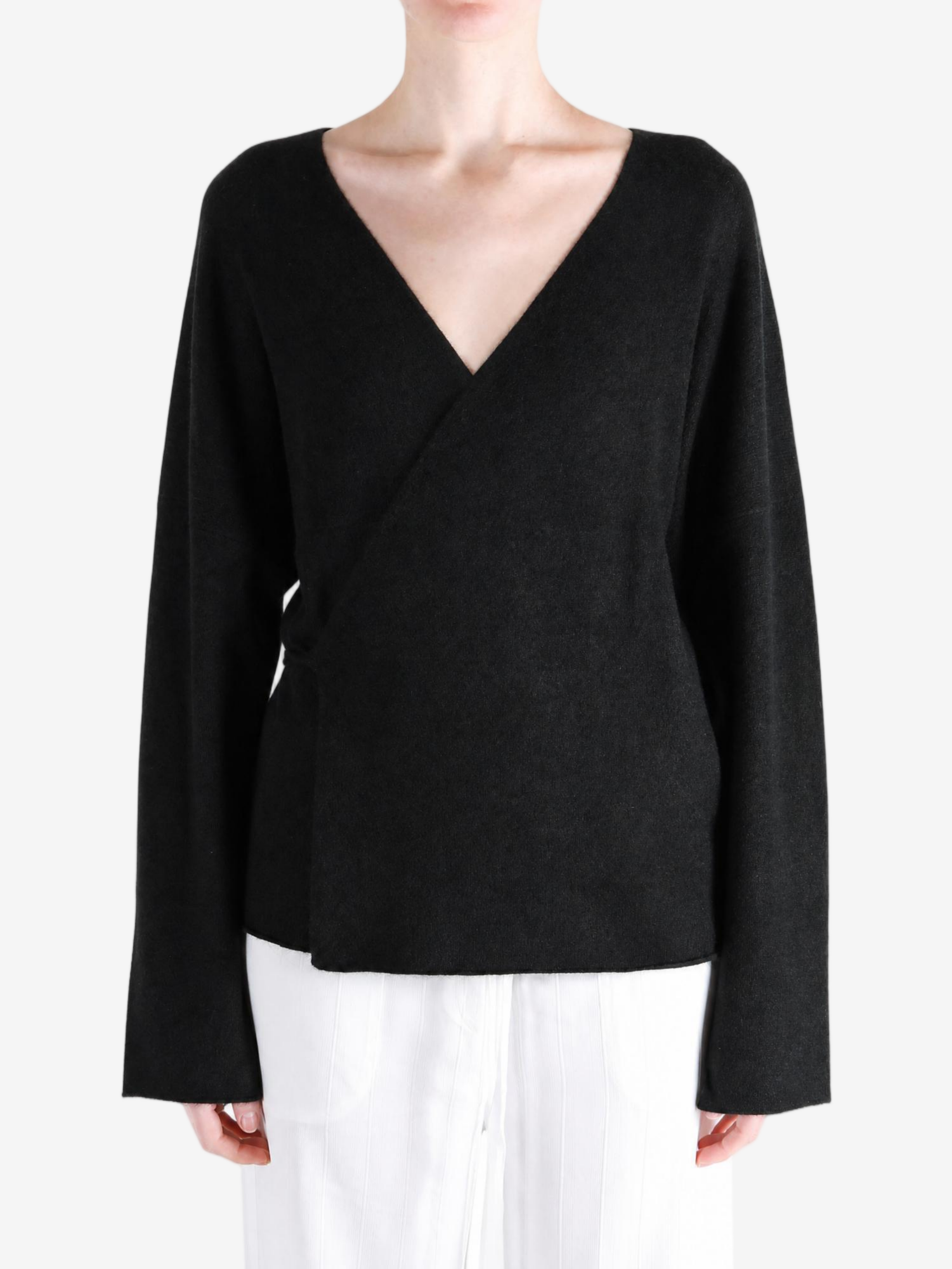Black jacket worn by a person, showing the jacket fit