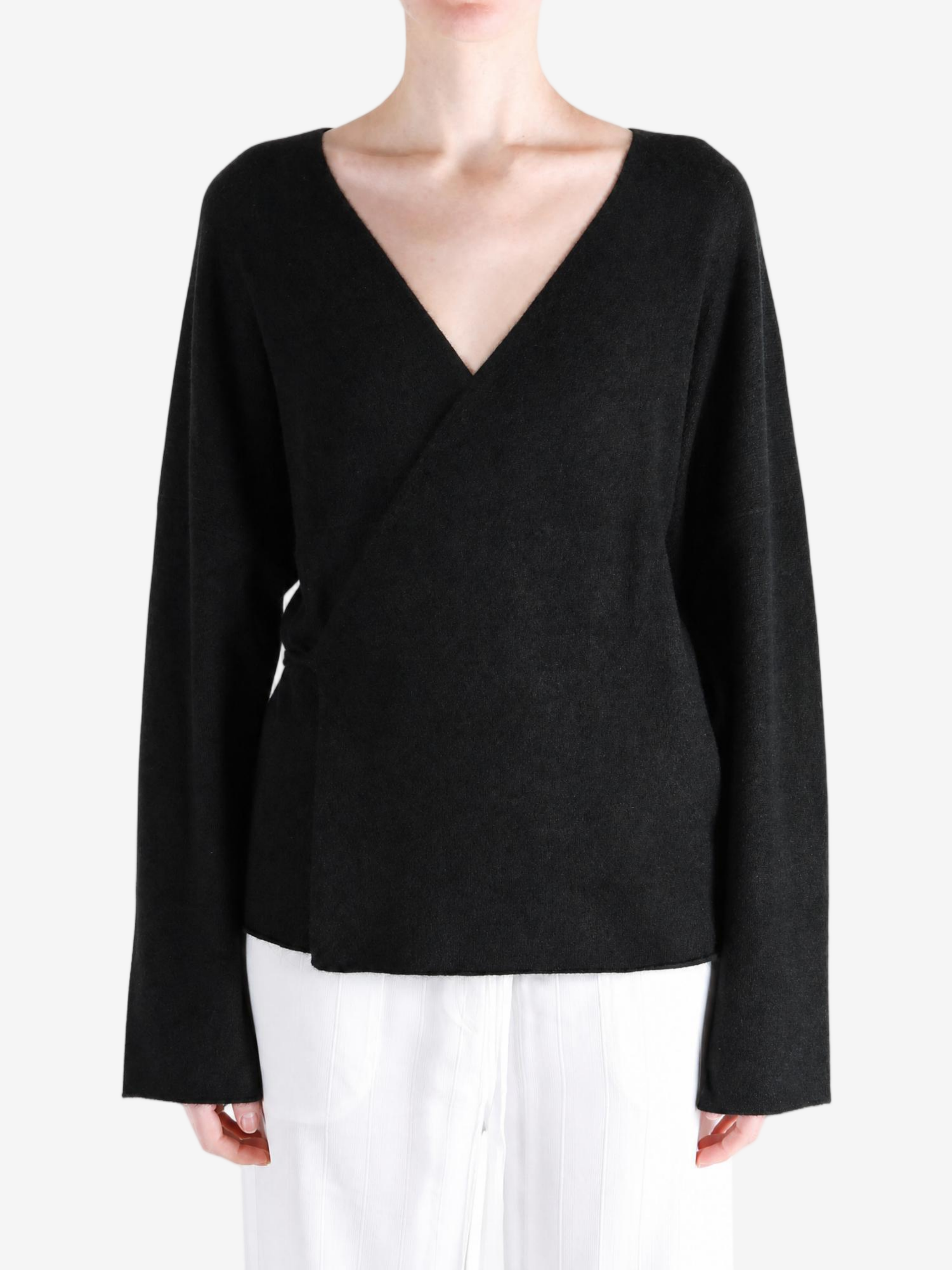 Black jacket worn by a person, showing the jacket fit