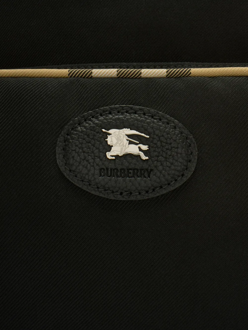 Close up of the black bag, showing texture of the polyester
