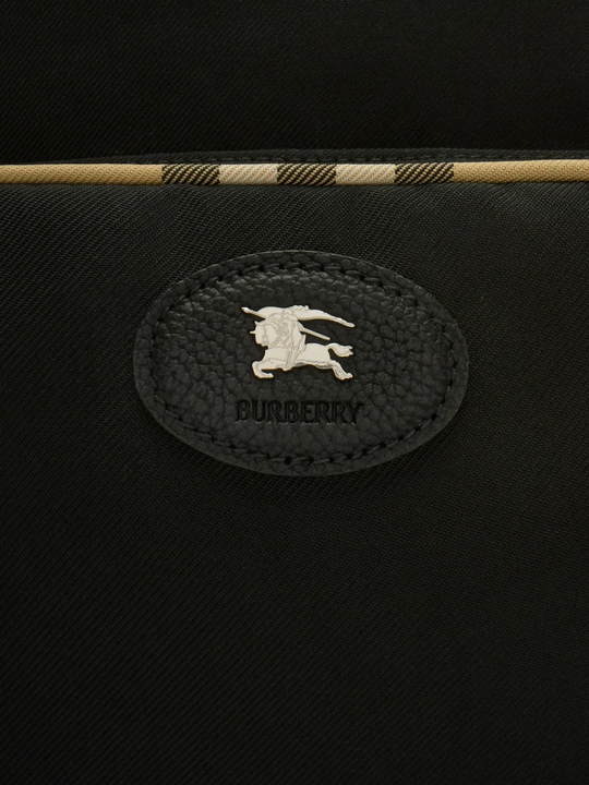 Close up of the black bag, showing texture of the polyester