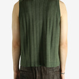 Green vest worn by a person, showing the vest fit