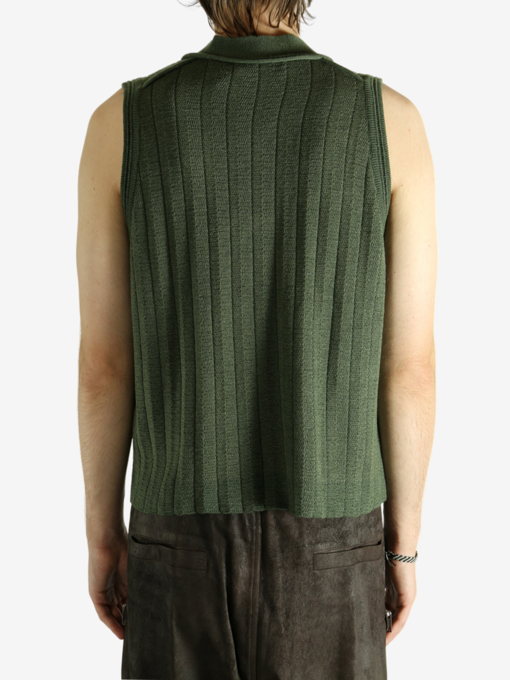 Green vest worn by a person, showing the vest fit