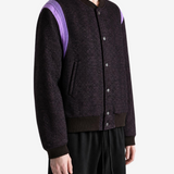 Purple jacket worn by a person, showing the jacket fit