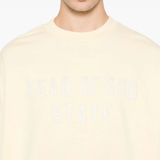 Close up of  yellow sweater,showing texture of the cotton fabric.