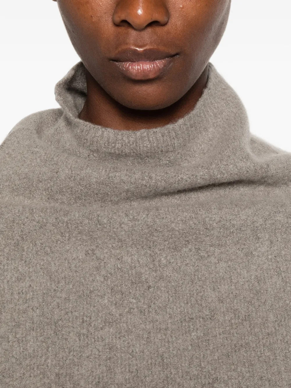 Grey top worn by a person, showing the top fit
