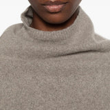 Grey top worn by a person, showing the top fit