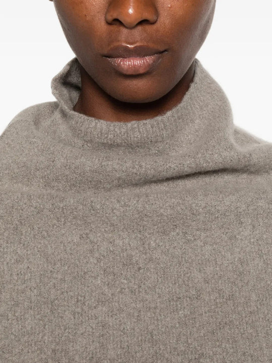 Grey top worn by a person, showing the top fit