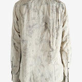 green shirts worn by a person, showing the shirts  fit