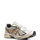 Tan sneakers, side view