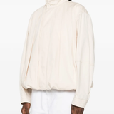 White jackets-coats worn by a person, showing the jackets-coats's fit