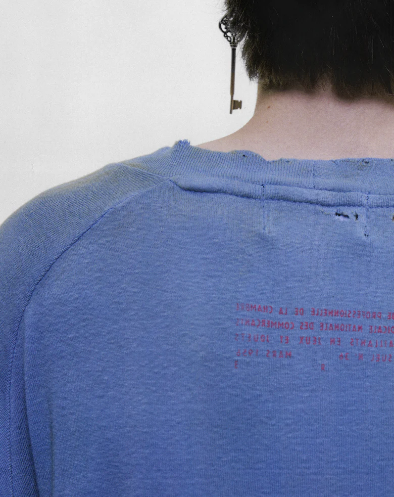 Blue t-shirt worn by a person, showing the t-shirt fit