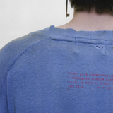 Blue t-shirt worn by a person, showing the t-shirt fit