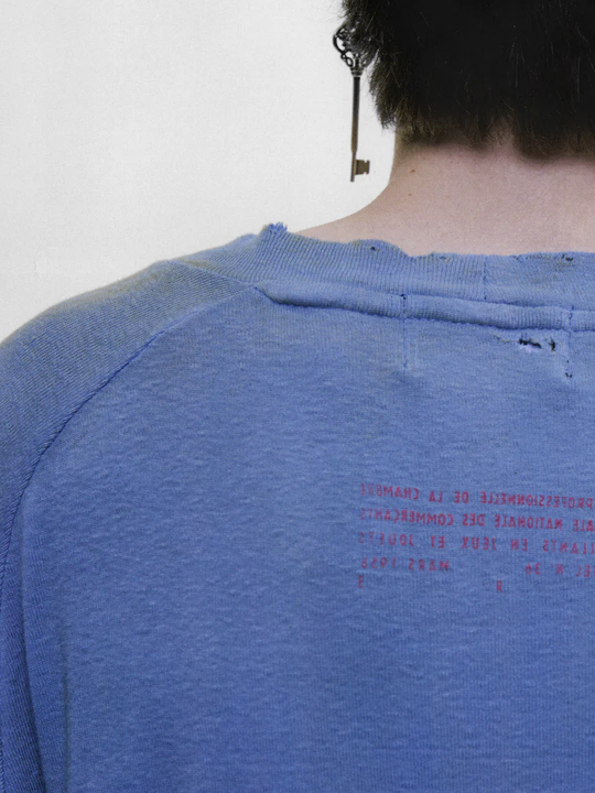 Blue t-shirt worn by a person, showing the t-shirt fit