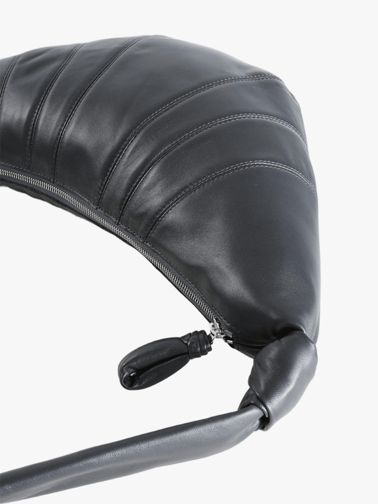 Close up of black bag, showing the texture of the leather