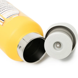 Close up of  Yellow Bottle ,showing texture of the Stainless Steel