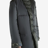 Black jacket worn by a person, showing the jacket's fit