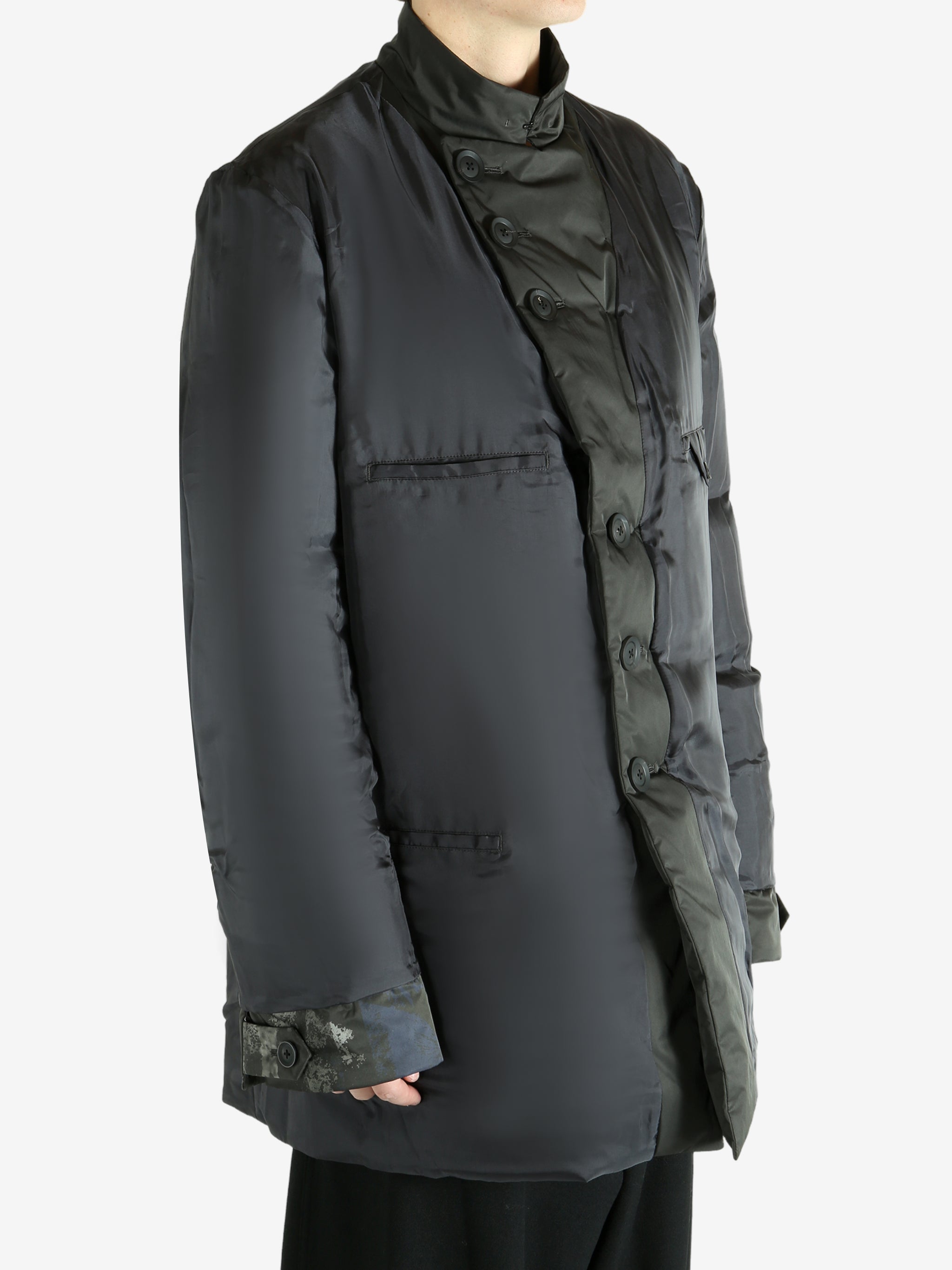 Black jacket worn by a person, showing the jacket's fit