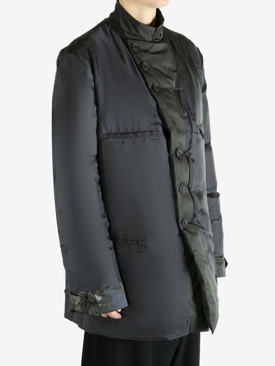 Black jacket worn by a person, showing the jacket's fit