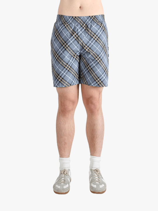 Blue shorts worn by a person, showing the shorts fit