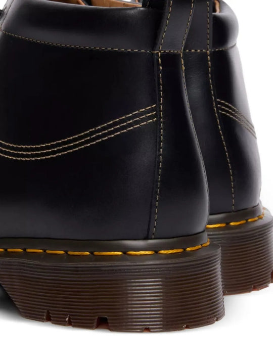 Close up of black shoes, showing texture of the leather fabric